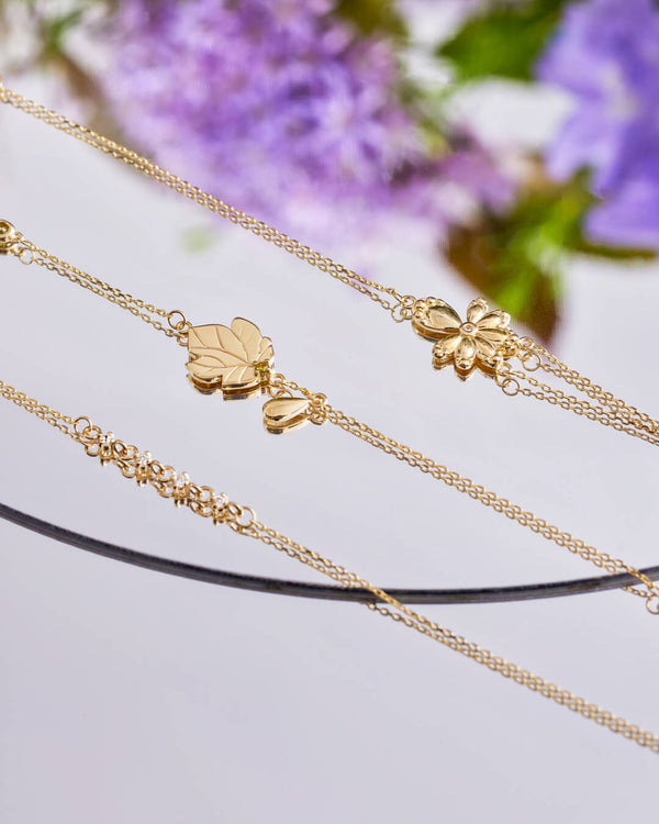 14K Gold White-Eyed Flower Diamond Bracelet